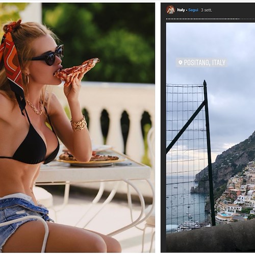 La supermodella russa Olya Abramovich addenta una fetta di pizza a Positano