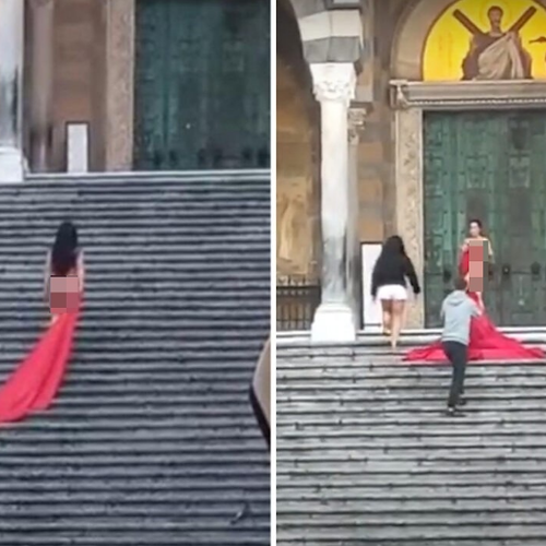 Shooting sulla scalinata del Duomo di Amalfi: modella posa coperta solo da un velo rosso / FOTO-VIDEO